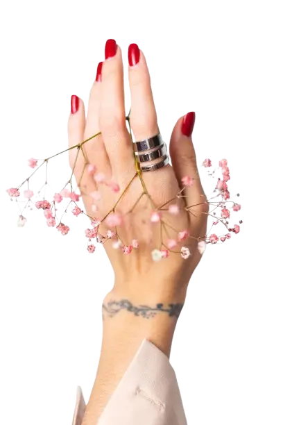 Women's hands with red nail polish and rings on their fingers are adorned with a pink flower garland. The text below reads "All kinds of trending nail designs are available along with nail colors and nail polishes.